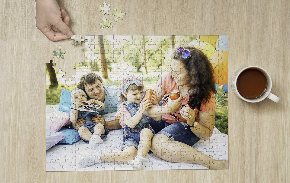 jigsaw puzzle on table with women and child art on it