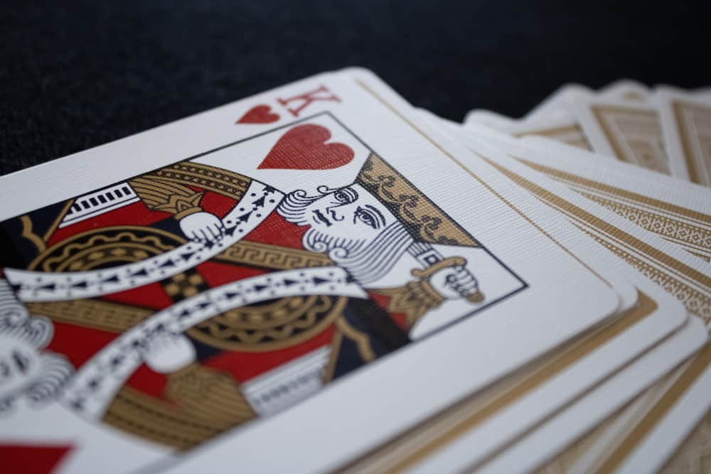 K of Heart is different from others. The King does not have mustache and the sword misses the tip. 