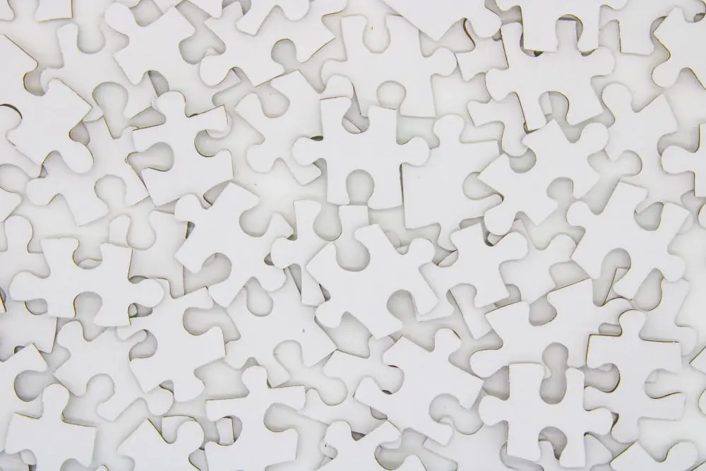 full screen of white pieces of jigsaw-puzzles