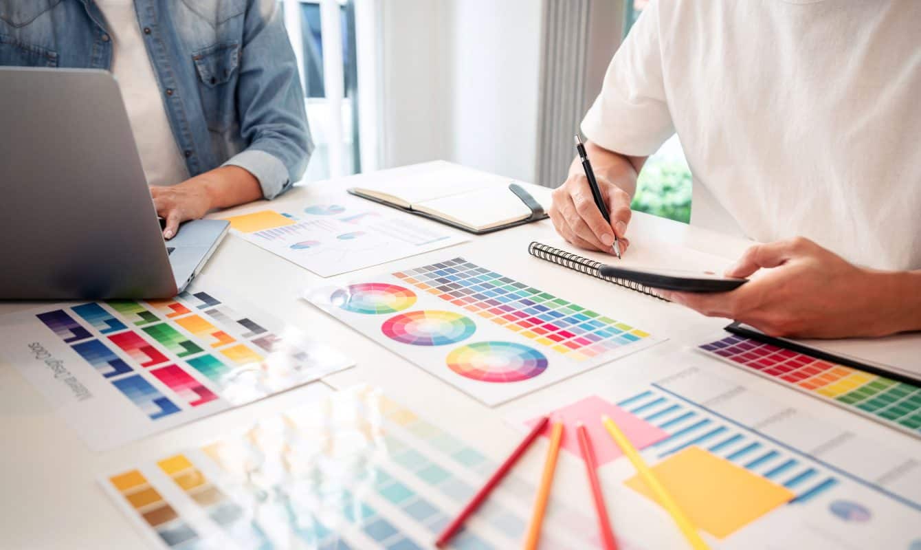 two-creative-graphic-designer-team-working on designs