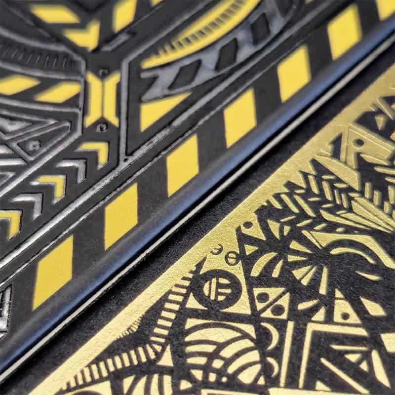 two card decks printed with hot and cold foil techniques respectively
