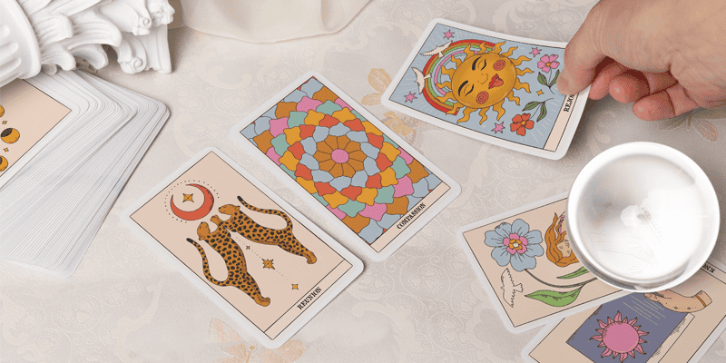 custom printed tarot cards laid on a surface with cloth