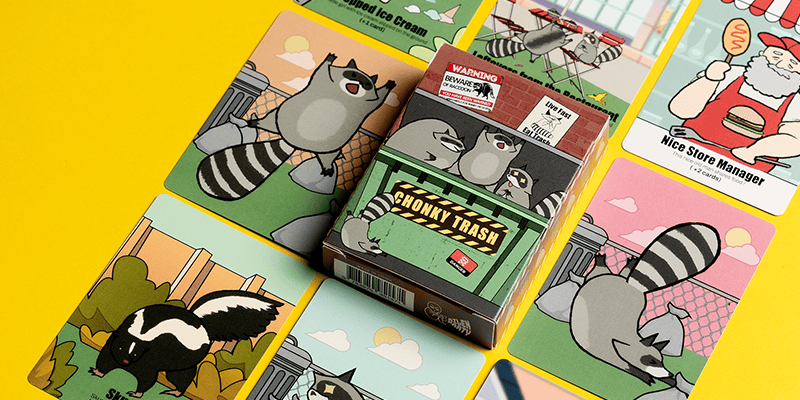 custom playing cards showing cartoon raccoon designs