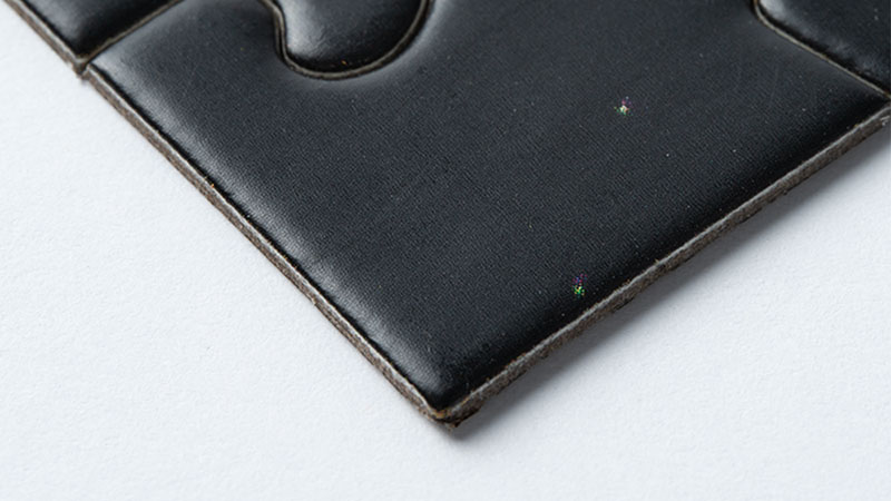 black puzzle piece with matte finish
