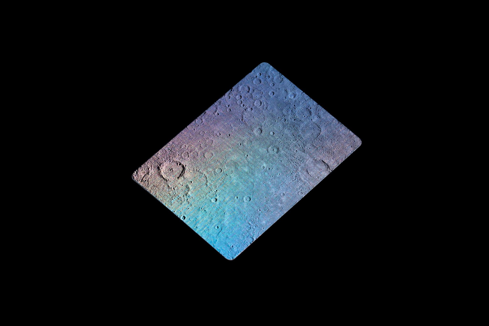 black background with holographic playing card in the middle