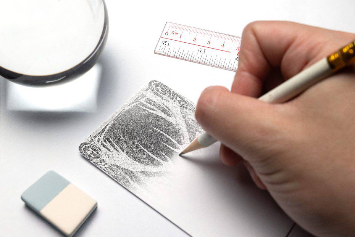 DIY hand drawing a deer design on a tarot card