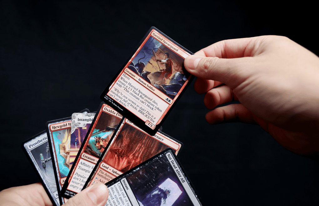 hand holding mtg cards