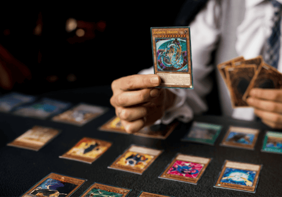 man holding trading card