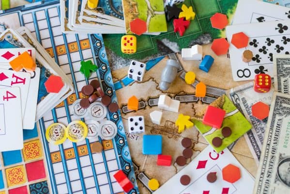 several different games, dices and cards on a table
