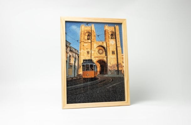 completed castle puzzle in wooden frame
