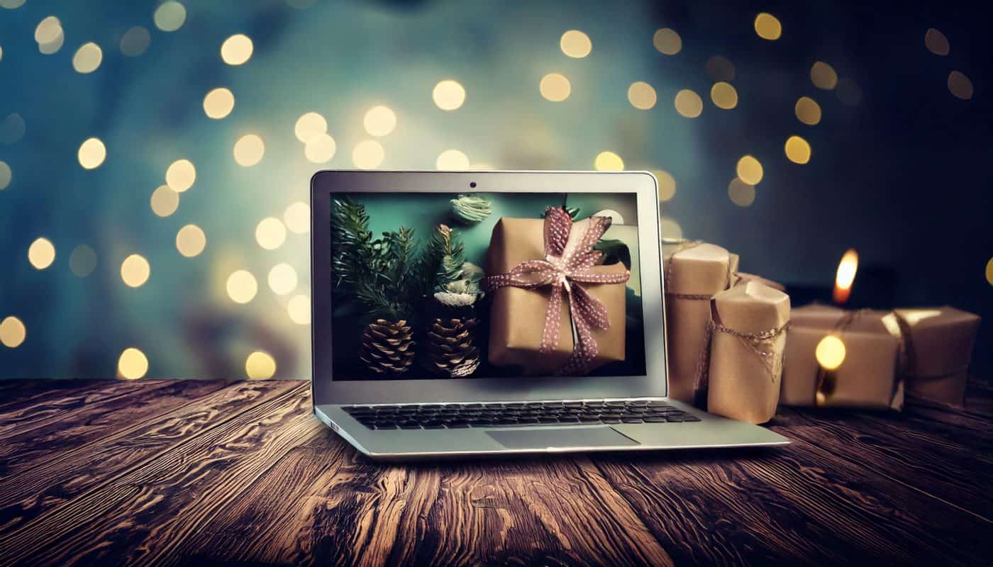 Where to Create Print on Demand Designs computer on a wooden table showing packages