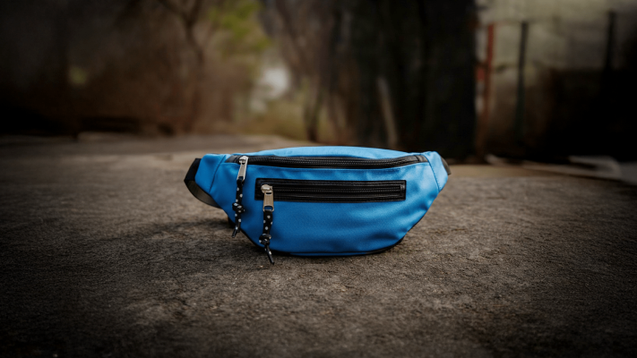 blue fanny pack on the ground