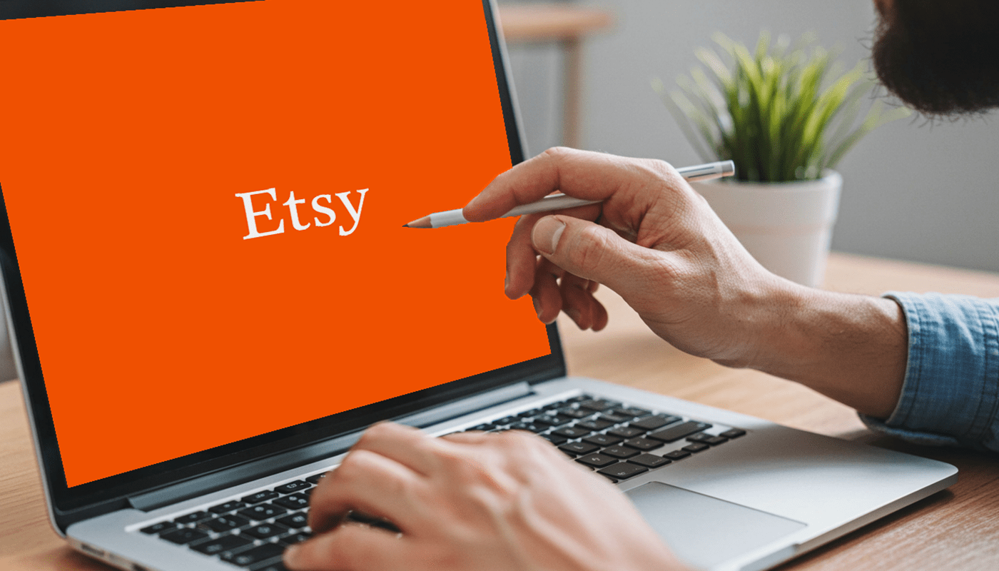 laptop screen with etsy logo for the how to make money on etsy blog